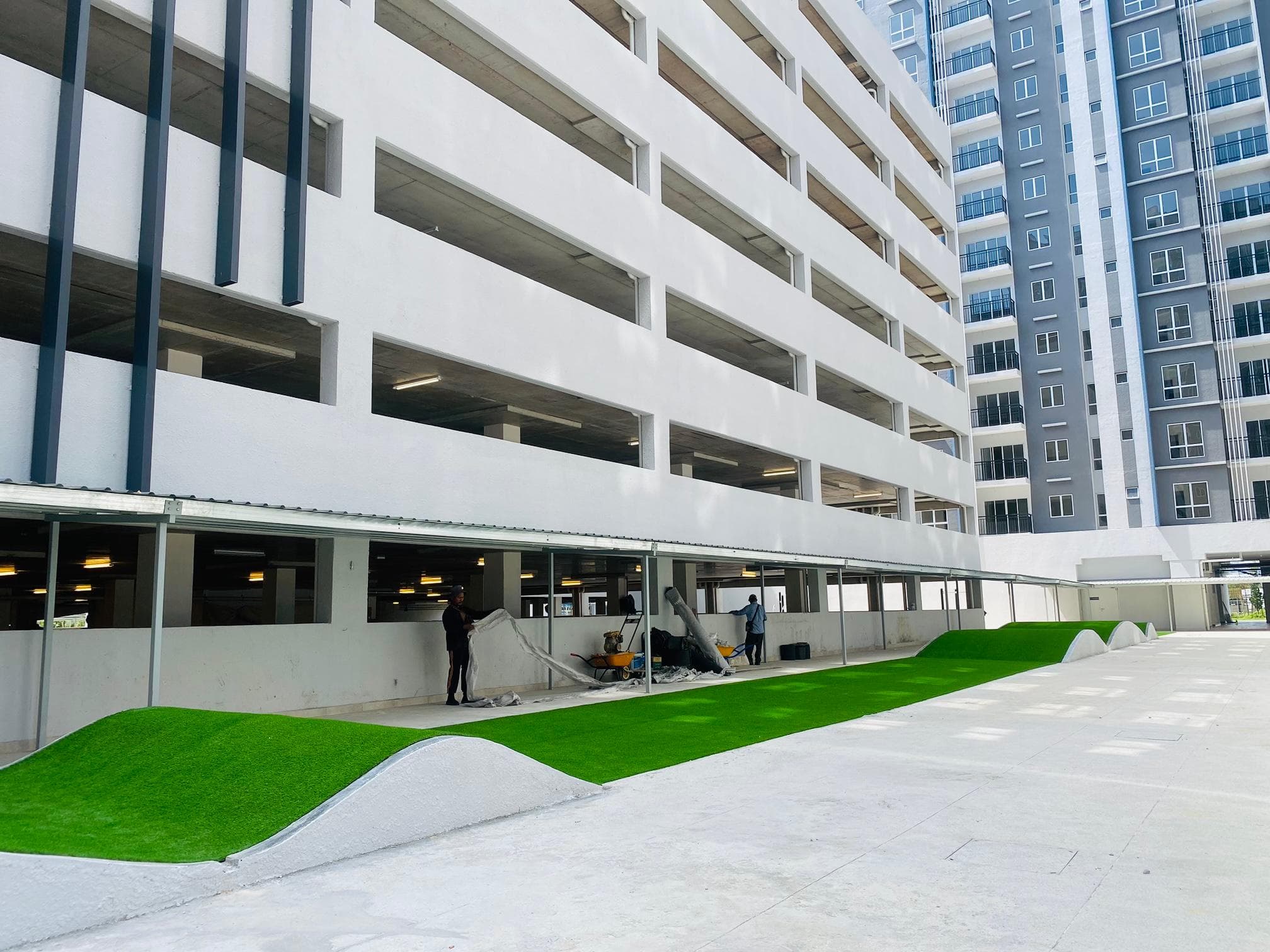 Artificial grass installation at Rumah Idaman in Bukit Jelutong, view 1